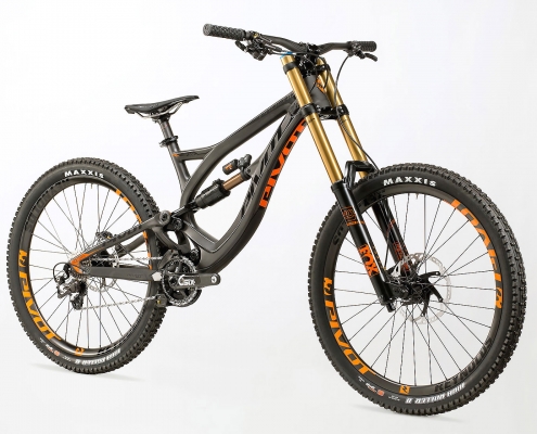 Product photography of Black carbon fiber Pivot Cycles, Phoenix model mountain bike with Reynolds wheels and Maxxis tires.